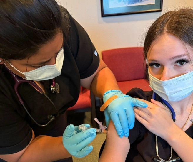 {{ school.name }} students training to administor blood draws {{ school.name }} students training to administor blood draws